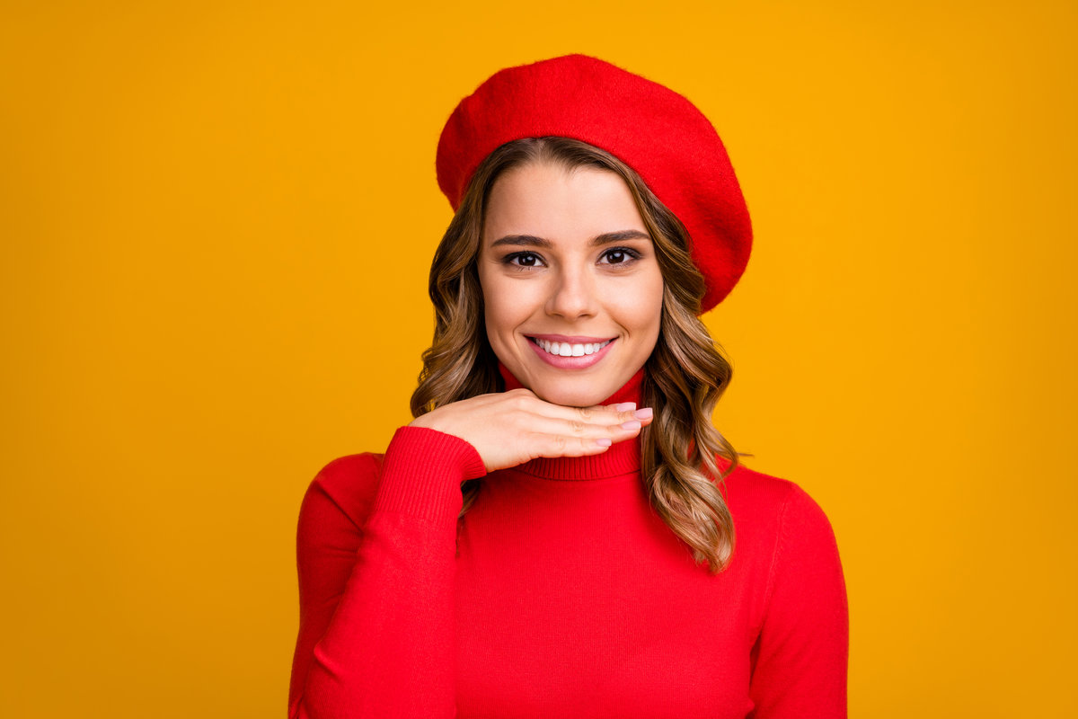 Close-up portrait of her she nice-looking attractive lovely fashionable, cheerful cheery wavy-haired girl showing perfect skin isolated on bright vivid shine vibrant yellow color background