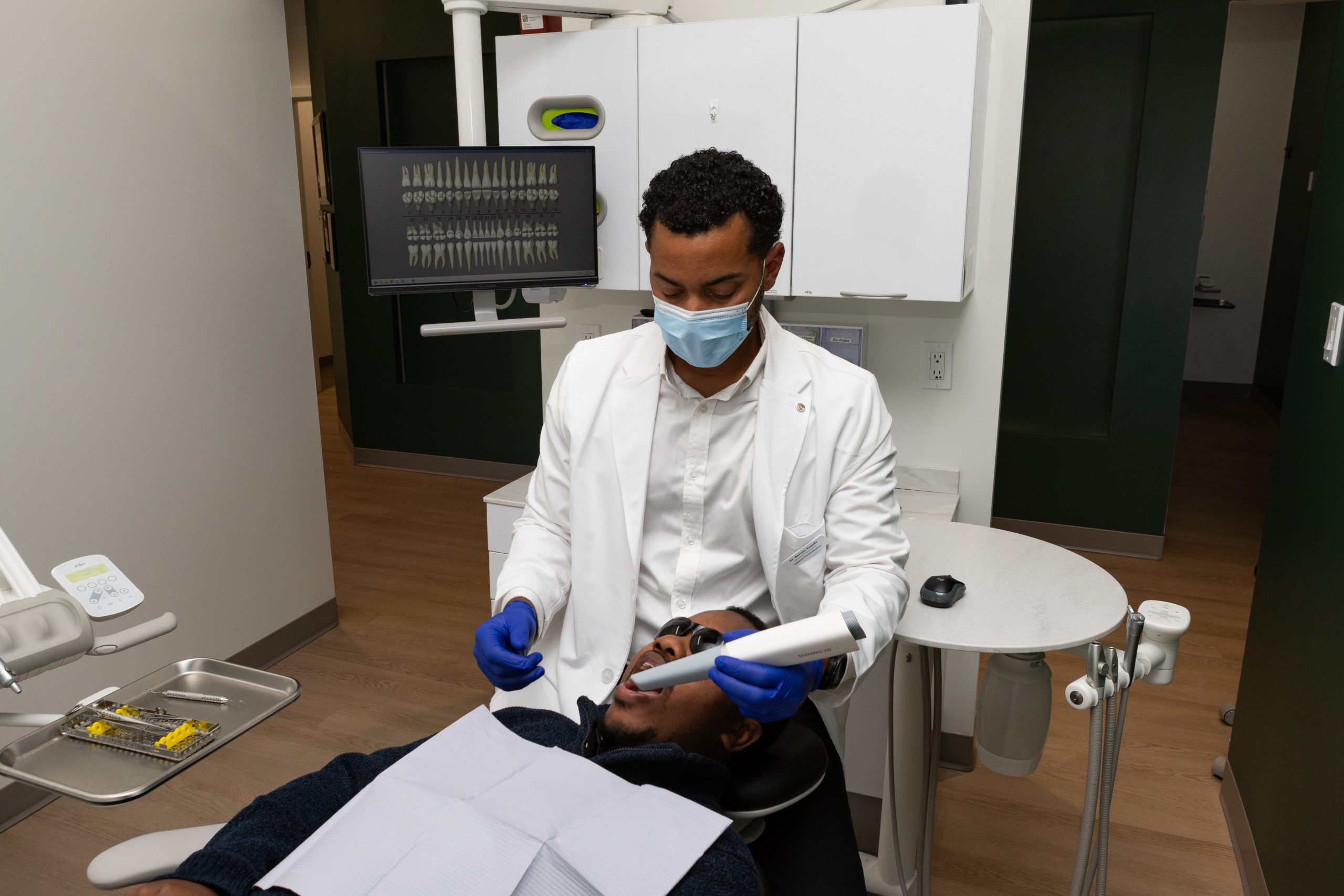Dental professional performing intraoral scanning procedure on patient at Evergreen Grace