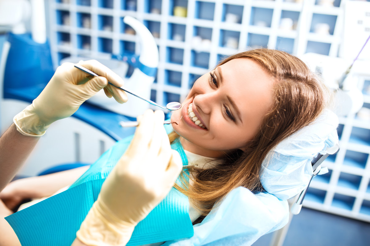 Happy women inside dental clinic