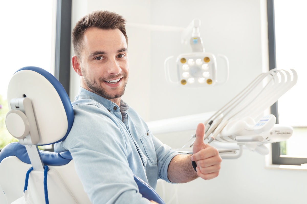 Man sitting on dental chair